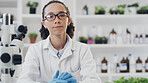 Woman, portrait and scientist with microscope in laboratory for medical research or chemistry. Female person, doctor or confidence with gloves or supplies for forensic study, analysis or service