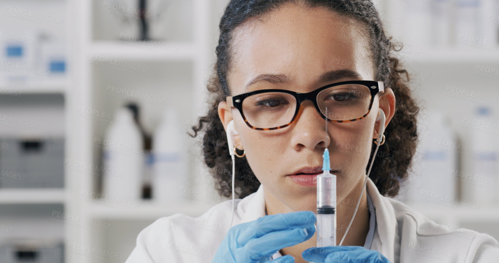 Buy stock photo Scientist, needle and woman with drug, earphones and chemical study in laboratory for education. Biotechnology, medical research and syringe for solvent project, podcast and experiment or synthesis