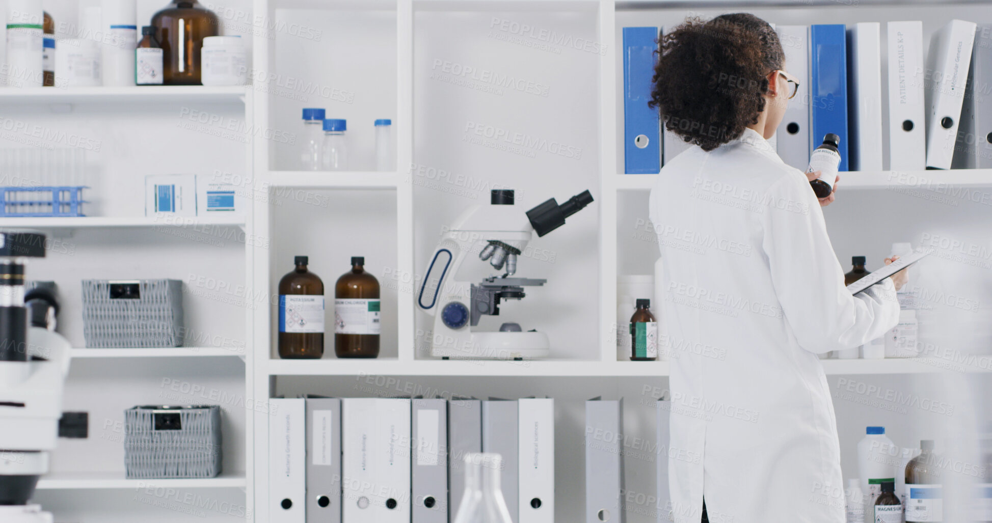 Buy stock photo Scientist, woman and reading bottle in lab with clipboard, review and medical research for drug trial. Back, person and science product in clinic with checklist, stock inspection and quality control.