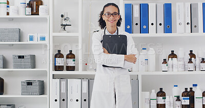 Buy stock photo Woman, scientist and smile with clipboard at lab for medical research, portrait or arms crossed with pride. Person, glasses and happy with pharmaceutical study, job or vaccine development in Colombia