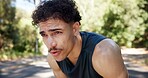 Exhausted, man and outdoor with breathing from cardio workout, exercise challenge and sports fatigue. Active person, sweat and tired in road with training break, fitness and recovery for wellness.