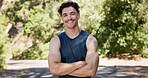 Portrait, fitness and happy man in street, arms crossed and confidence with nature. Outdoor, runner and person with pride, wellness and commitment to training routine, health benefits and exercise