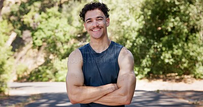 Buy stock photo Portrait, fitness and happy man in street, arms crossed and confidence with nature. Outdoor, runner and person with pride, wellness and commitment to training routine, health benefits and exercise