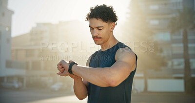 Buy stock photo Exercise, outdoor or man with smart watch, training or digital app to track progress. Check time, person or athlete with challenge, break or monitor heart rate for cardio workout or fitness in Canada