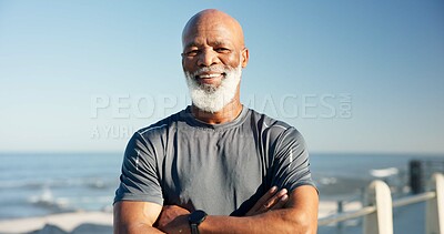 Buy stock photo Portrait, black man and arms crossed for fitness at beach with pride, exercise and cardio training. Smile, senior person and runner for endurance workout, retirement challenge and fresh air in nature