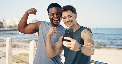 Buy stock photo Friends, fitness and selfie with muscle on beach promenade with flexing bicep, excited and post on web. Happy people, photography and strong with social media, space or exercise on seaside boardwalk