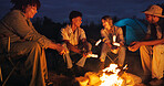 Friends, camping and fire with marshmallow for travel at night, adventure and social gathering. Smile, people and flames for smores snack, group reunion and bonding together on vacation in wilderness