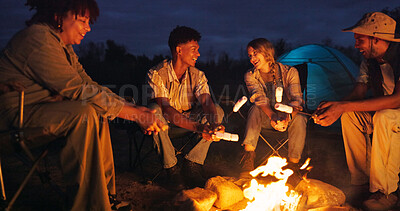 Buy stock photo Friends, camping and fire with marshmallow for travel at night, adventure and social gathering. Smile, people and flames for smores snack, group reunion and bonding together on vacation in wilderness