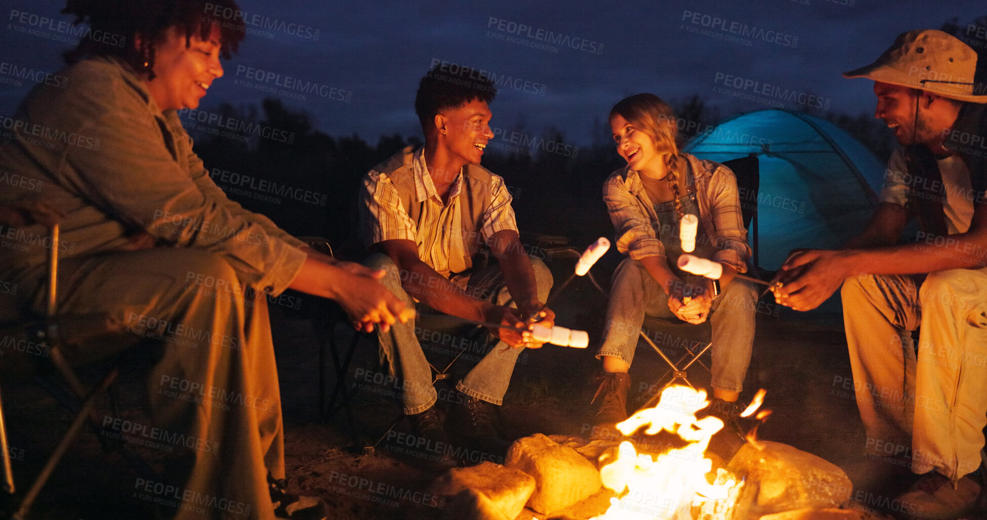 Buy stock photo Friends, camping and fire with marshmallow for travel at night, adventure and social gathering. Smile, people and flames for smores snack, group reunion and bonding together on vacation in wilderness