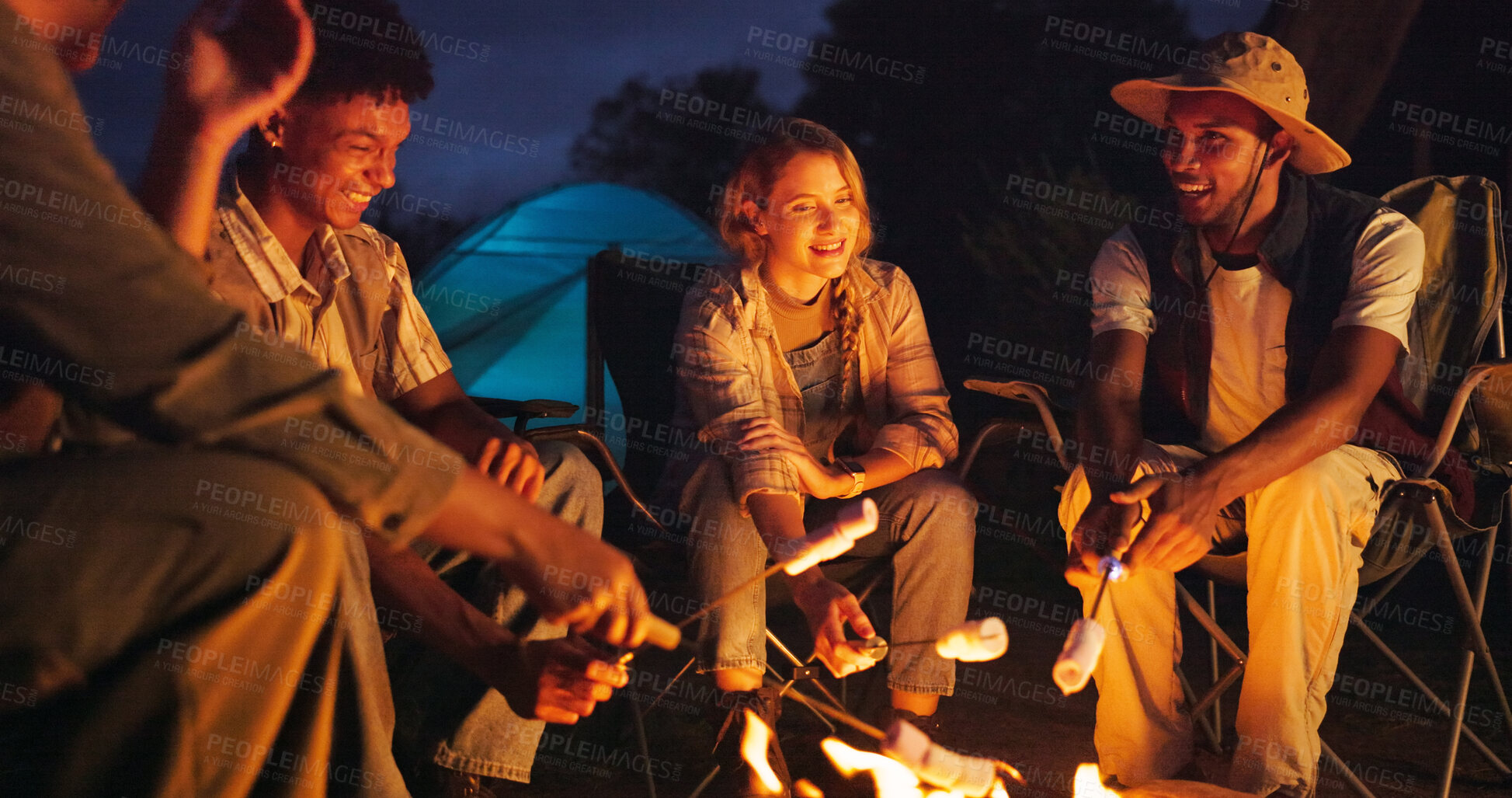 Buy stock photo Friends, camping and flames with marshmallow at night for travel, adventure and social gathering. Smile, people and fire for smores snack, group reunion and bonding together on vacation in wilderness