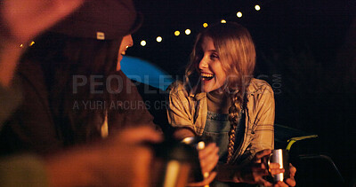 Buy stock photo Friends, camping and smile with coffee at night for travel, funny and social gathering. Outdoor, people and group reunion with joke, laughing or bonding together on vacation in wilderness and evening