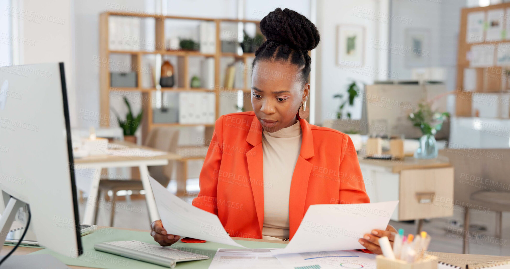 Buy stock photo Black woman, reading and document in office with computer, financial statement and report for business. Female person, review and check paperwork in workplace with desktop, finance info and proposal.
