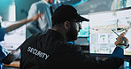 Man, security officer or pointing with surveillance for crime detection or safety in control room. Male person, guard or monitoring with radio coverage or cctv footage for alert or protection service