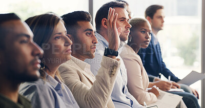 Buy stock photo Man, raised hand and audience at conference for business people for questions, insight or feedback. Person, crowd and gesture for review, workshop or group with notes at corporate training convention