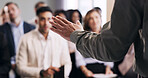 Hand, speaker and speech to audience in seminar for insight, knowledge and career development. Summit event, person and keynote address to business crowd for industry trends, learning and information