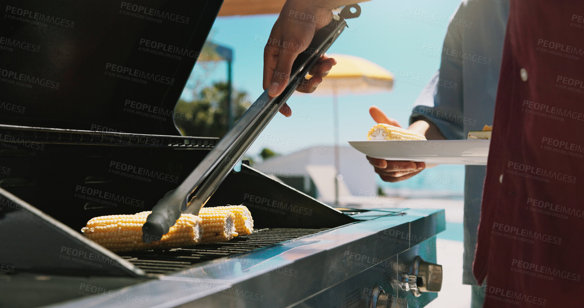 Buy stock photo Bbq, corn and grill with hands of person outdoor of house for cooking, cookout event and barbecue. Summer vacation, weekend break and tongs with people on patio of home for vegetable, lunch and food