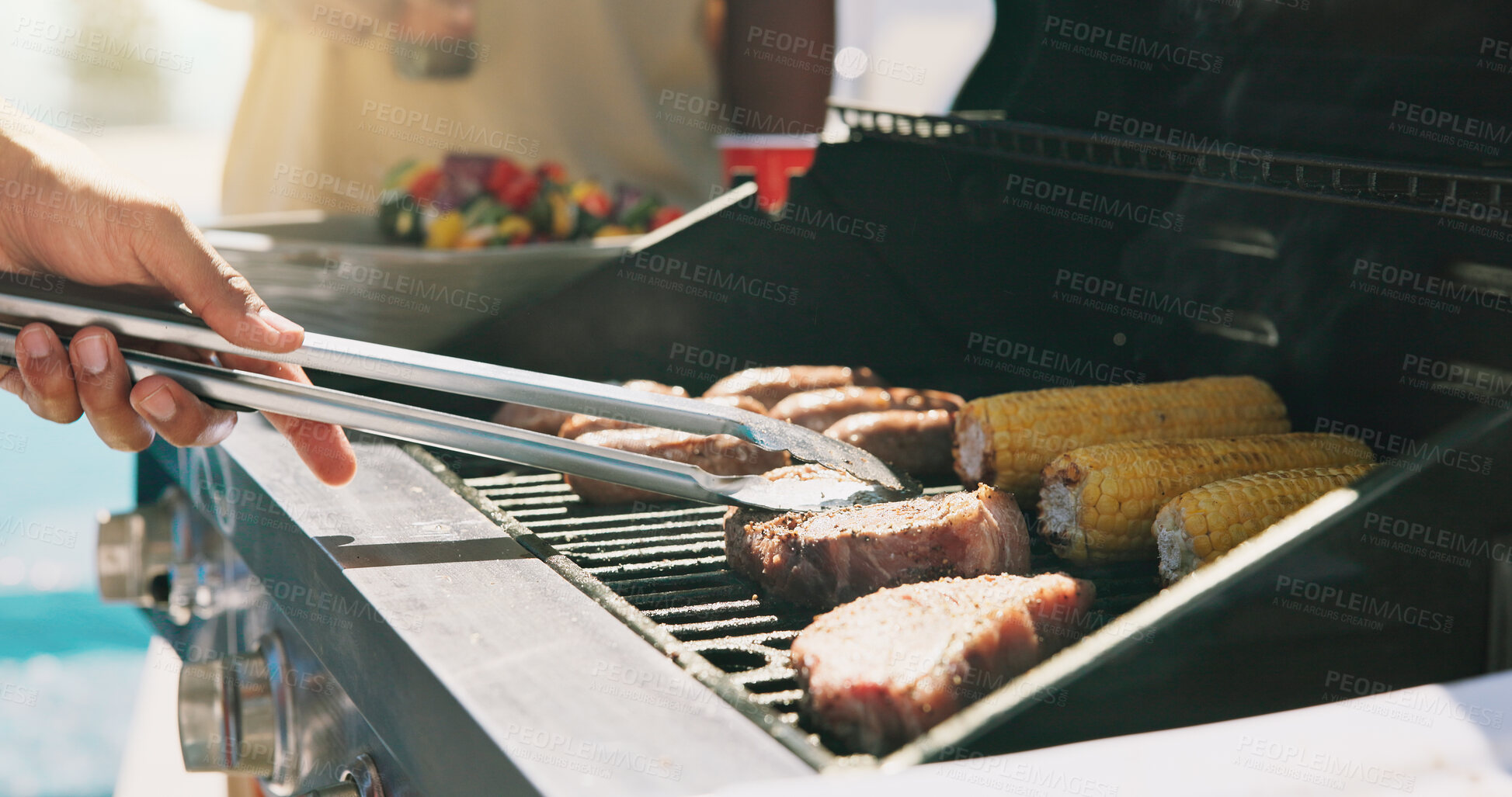 Buy stock photo Bbq, steak and cooking with hands of person outdoor for grill, cookout event and beef. Summer vacation, weekend break and tongs with people and barbecue in backyard of home for meat, support and corn