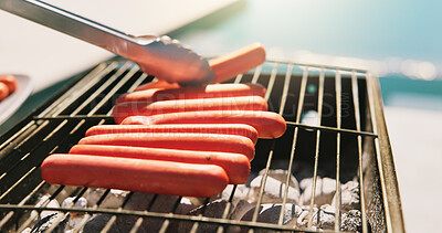 Buy stock photo Bbq, hotdog and tongs with hands of person outdoor for cooking, cookout event and barbecue. Summer vacation, weekend break and grill with cook in backyard of home for meat, lunch and food prep