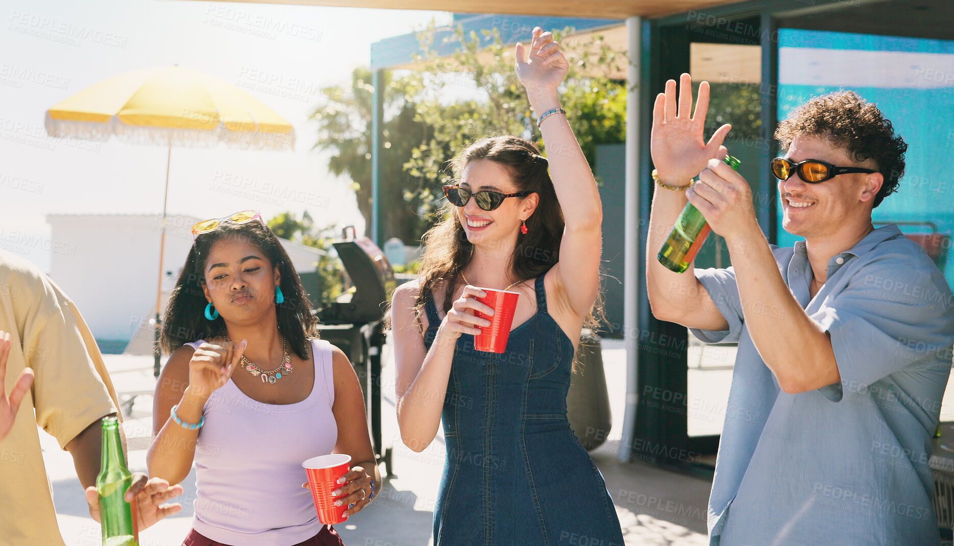 Buy stock photo Dance, beer and smile with friends outdoor for social reunion, summer vacation and music. Happiness, weekend break and gen z hangout with group of people on patio of home for energy and party