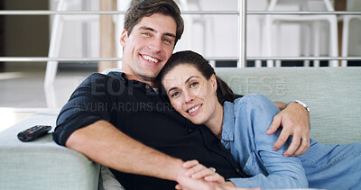 Buy stock photo Watching tv, couple and hug on break, home and bonding with movies, love and affection with partner. People, smile and streaming film on weekend, man and embrace with woman or entertainment in lounge