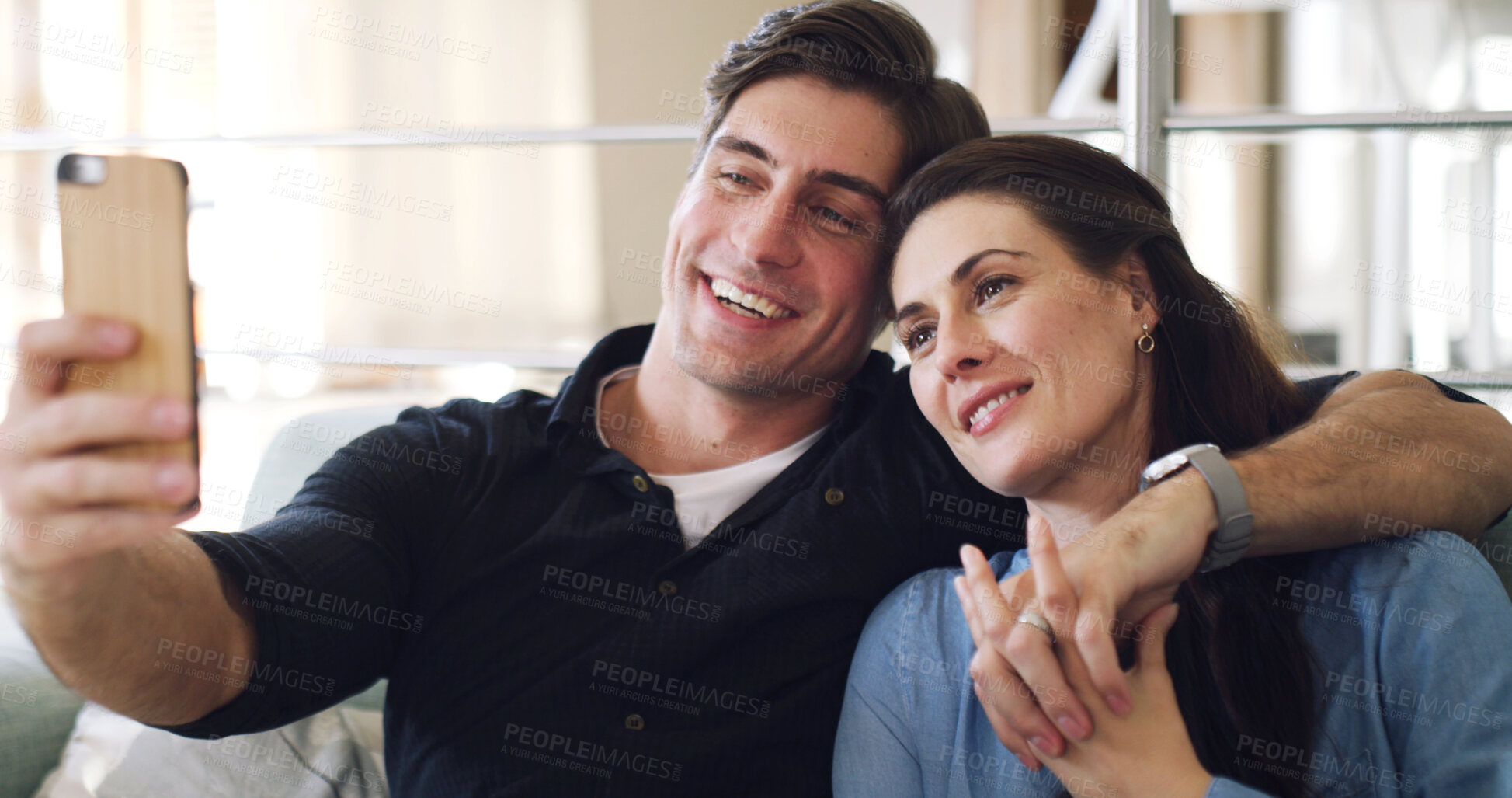 Buy stock photo Happy couple, selfie and relax on sofa in home with bonding, connection or care with web post. Man, woman and smile with partner, photography or hug with love for social media on couch at apartment