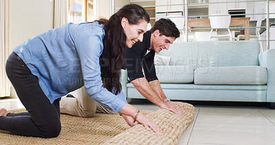 Buy stock photo Carpet, moving and help with couple in new house for interior design, real estate and property investment. Home renovation, rug decoration and support with man and woman in living room of apartment