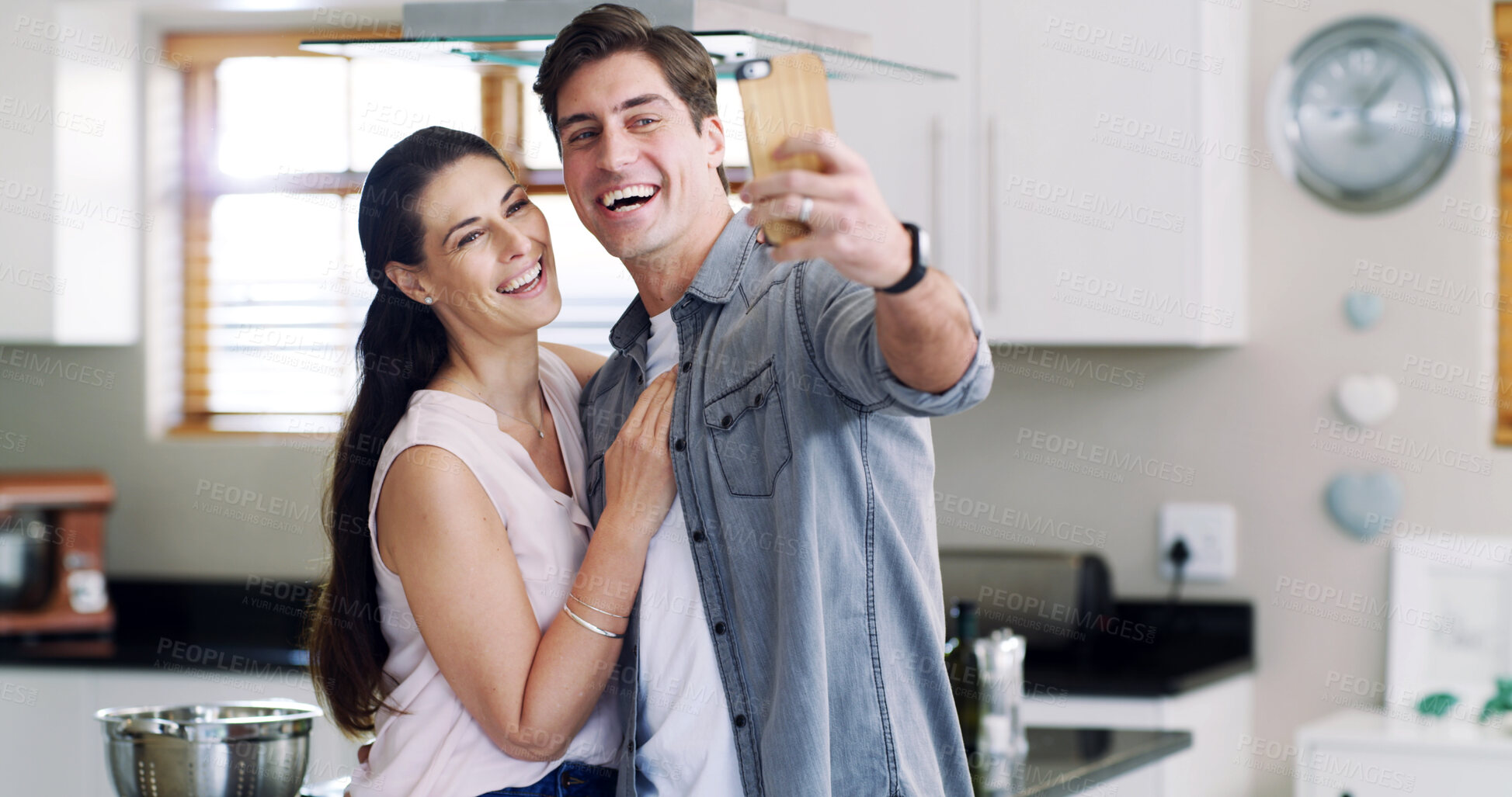 Buy stock photo Photography, smile and couple with selfie in kitchen, social media post and capture moment for memory. Connection, bonding and people with laugh for profile picture, support and happiness in home