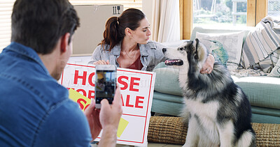 Buy stock photo New home, couple and smartphone for picture, dog and property investment for success. Pet owner, man and woman in lounge, cellphone for memory and achievement for real estate purchase and sold sign