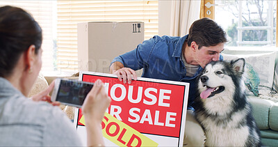 Buy stock photo New home, couple and smartphone for photography, dog and property investment for achievement. Animal care, man and woman in lounge, cellphone for memory or goals for real estate purchase, app and pet