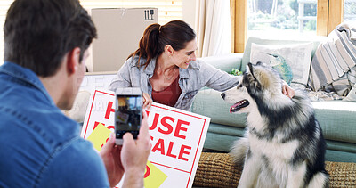 Buy stock photo New home, couple and cellphone for picture, dog and property investment for goals. Pet owner, man and woman in lounge, smartphone for memory and achievement for real estate purchase and animal care