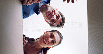Buy stock photo Unpacking boxes, portrait and low angle with couple in new home, property investment and love. Rental apartment, cardboard or man with woman, romance and smile in lounge, relationship or real estate