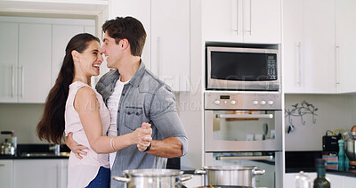 Buy stock photo Smile, cooking and couple in kitchen, dancing together and celebration for relationship. Home, man and woman with movement, music or funny moments for marriage, love or radio playlist for fun or care