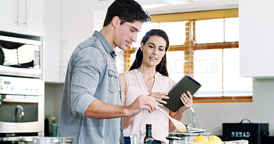 Buy stock photo Help, cooking and happy couple in kitchen, tablet for online recipe and digital app for food website. Nutrition, man or tech for wellness, woman or instructions for healthy meal, home or conversation