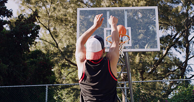 Buy stock photo Man, back view and throw with basketball for score, game point or outdoor match on court. Active, male person or aim with shot or technique for playful sport, fitness or physical activity on pitch