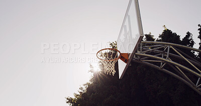 Buy stock photo Basketball, hoop and board in nature for game, competition and training with space outdoor. Rim, backboard and glass for sports with net, sky and sunshine for tournament with low angle of stanchion