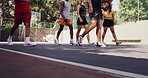 Group, legs and people prepare on basketball court for competitive, collaboration or support. Training game, teamwork or outdoor athletes for solidarity, fitness or workout in match or challenge