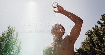 Buy stock photo Man, low angle and splash on basketball court for outdoor sport, competition or fitness game. Athlete, water and sweat with liquid for health, hydration and training in summer for exercise or workout