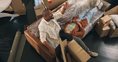 Buy stock photo Moving, relax or couple on sofa in new home, property or investment commitment for real estate purchase. Chat, homeowner or mature African people with bonding in residence, above or unpacking break
