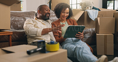 Buy stock photo Boxes, relax and tablet with African couple in new home together for planning or property investment. App, conversation and real estate with people on apartment floor for moving house or relocation
