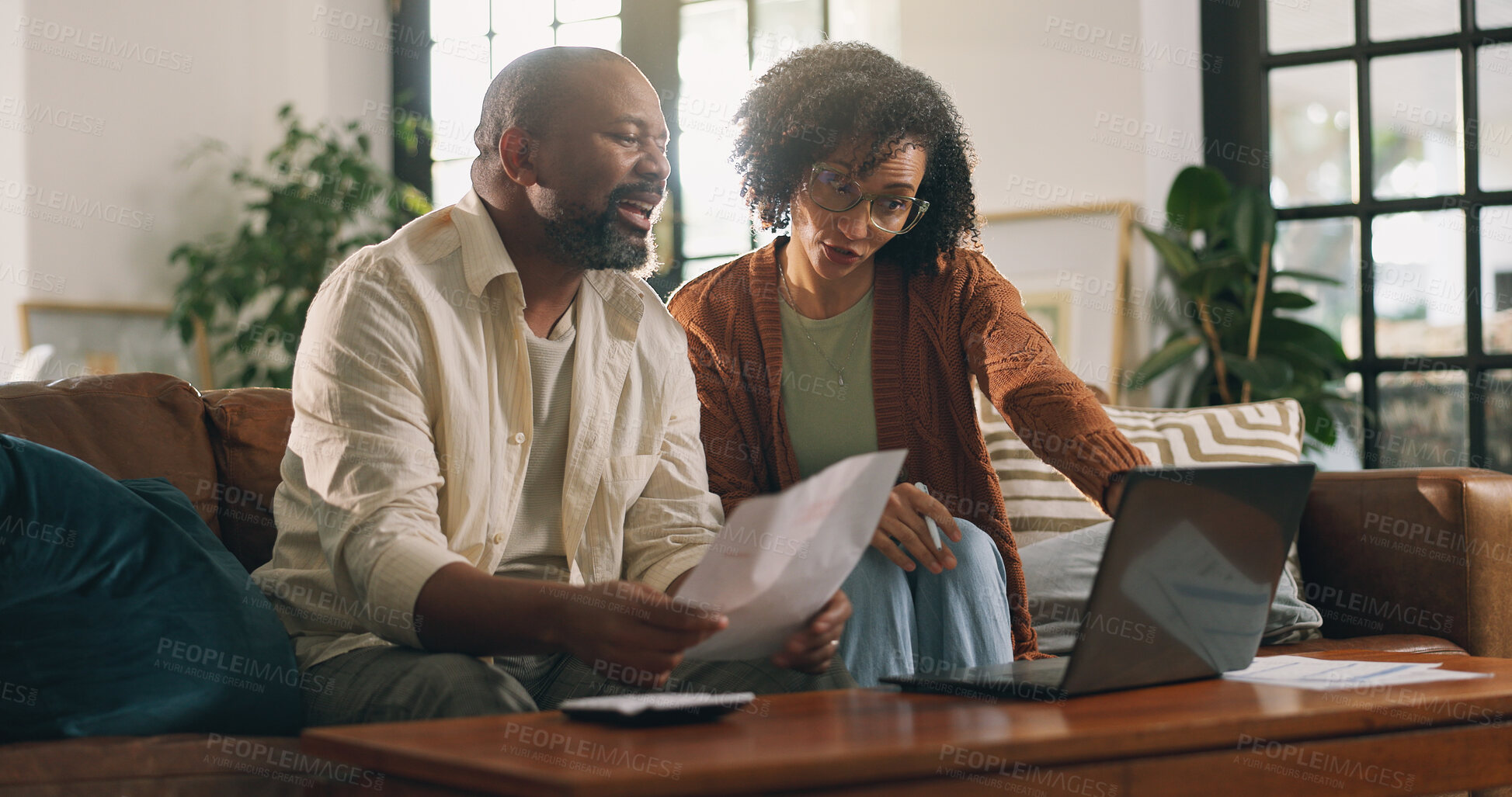 Buy stock photo Mature couple, document and laptop in home with discussion, online bills and website for mortgage loan. Married black people, talk and paperwork in house with computer, expenses or insurance invoice.