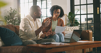 Buy stock photo Discussion, paperwork and couple with laptop on sofa, budget planning or track expenses for savings. Talk, income statement or mature African people with mortgage payment bills, flare and pc in home