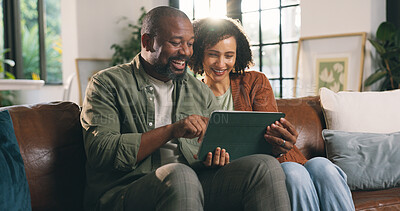 Buy stock photo Mature couple, smile and tablet in house with social media video, online entertainment and bonding. Happy, black people and digital tech in home with marriage, browsing internet and relax on weekend.