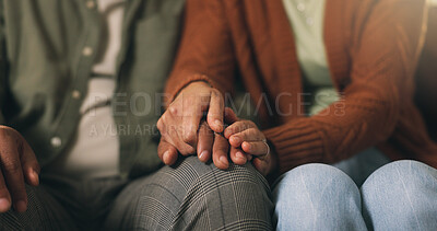 Buy stock photo Couple, holding hands and empathy with comfort on sofa for understanding or bonding in home. Closeup, man and woman with love, care or commitment for relationship, support or trust together in house