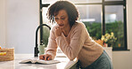 Woman, reading and kitchen with bible for god study, religious belief or christianity in home. Female person, christian and faith with gospel or holy book for religion, worship or praise in house