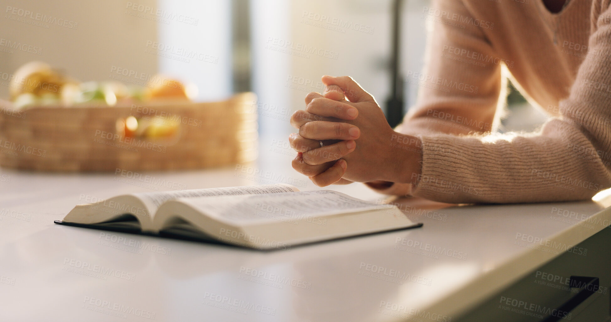 Buy stock photo Bible, prayer and hands of woman in home with comfort, support or religion for spirituality. Worship, trust and person with praying by holy book for reading gospel with gratitude or peace in house.