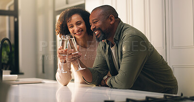 Buy stock photo Home, toast and couple in kitchen, champagne for celebration and smile for anniversary. Mature people, apartment and man with woman, romance and alcohol for cheers, happiness and love with wine