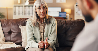 Buy stock photo Therapy, anxiety and talking with woman on sofa for counseling, meeting or support. Mental health, advice and progress with mature person in clinic for therapist session, trauma recovery and help