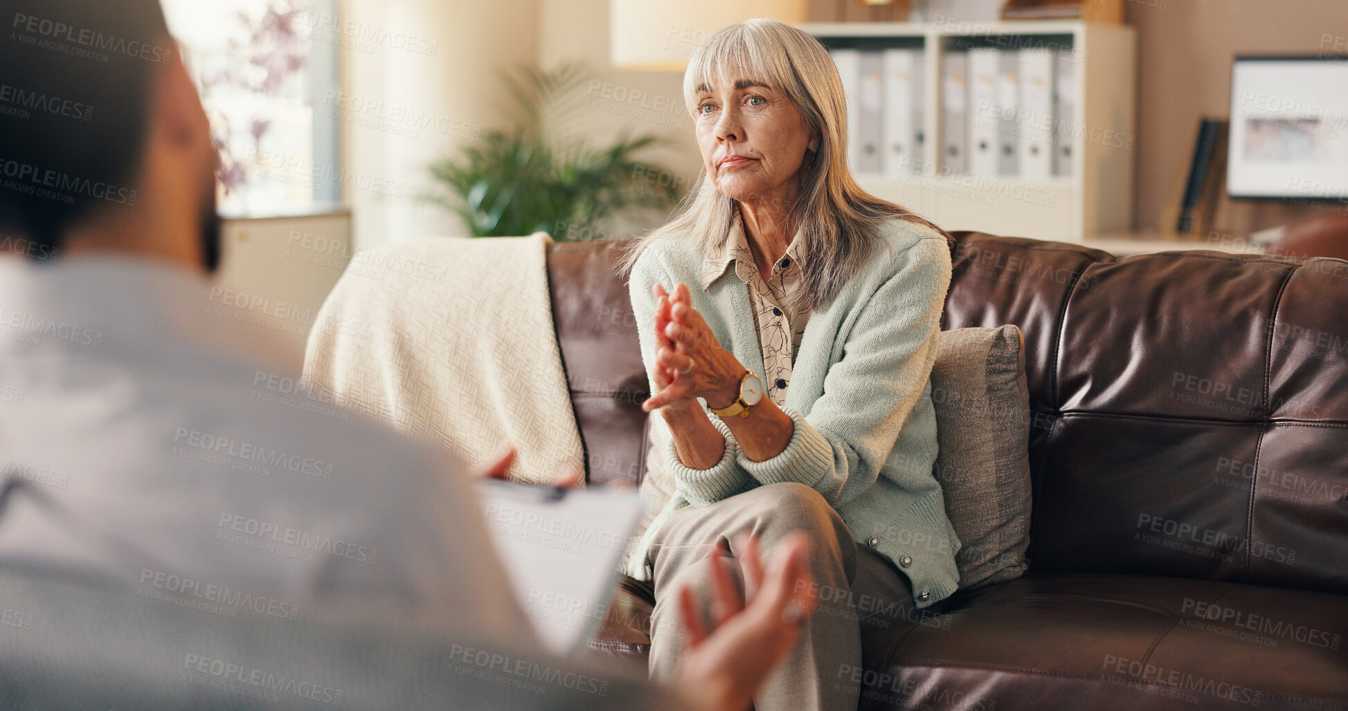 Buy stock photo Listen, client or old woman in therapist office, mental health support or assessment results for diagnosis. Psychologist, counseling or senior person with advice for wellness, evaluation info or help