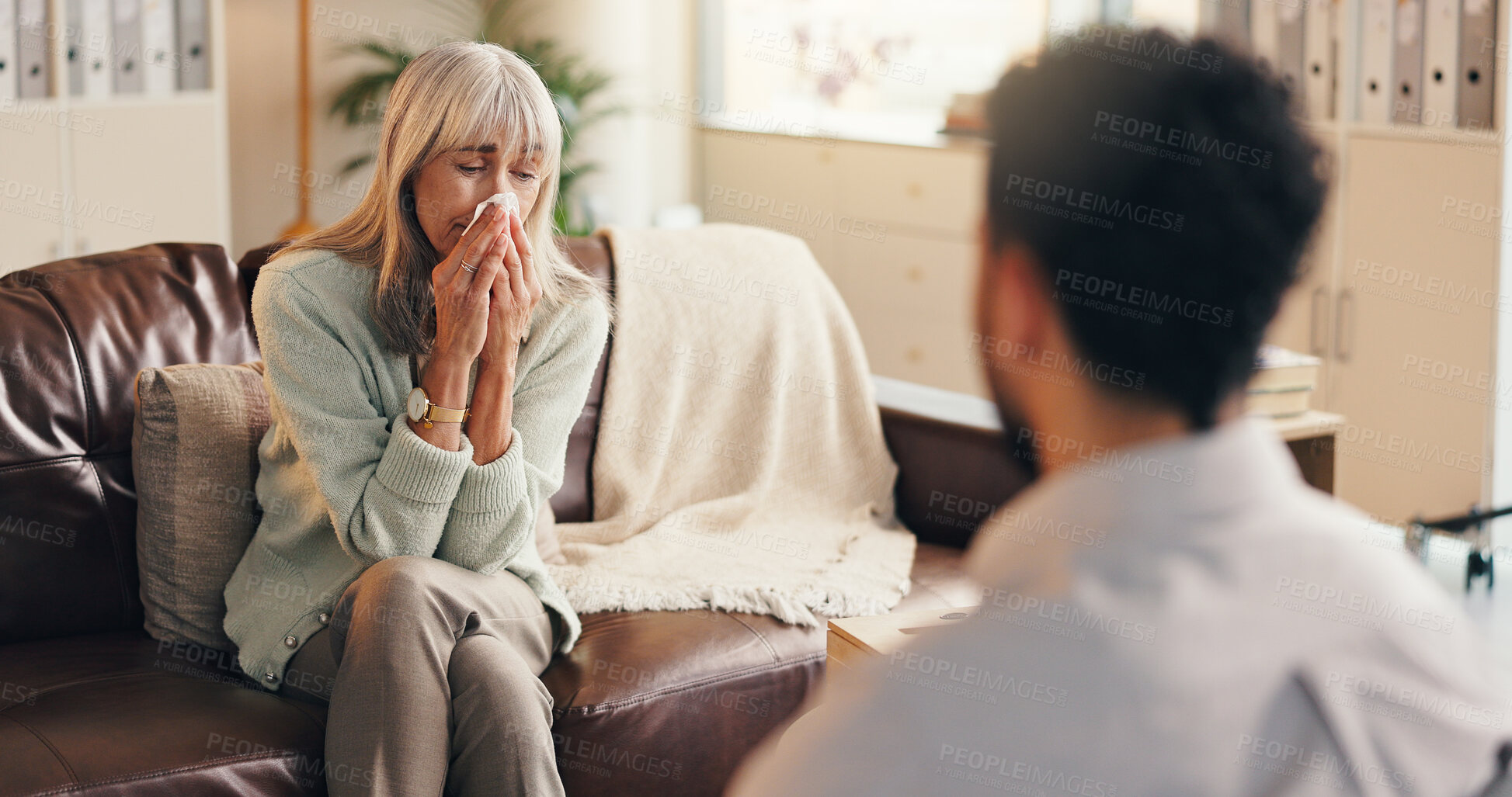 Buy stock photo Sad woman, therapist and crying with tissue for counseling, mental health or emotional support. Mature, female person or talking with psychologist for understanding, advisory or help in practice