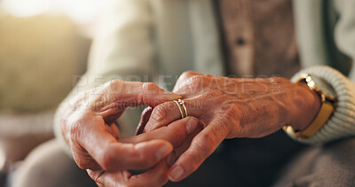 Buy stock photo Hands, thinking and wedding ring with senior person on sofa in living room for grief, loss or pain. Marriage, regret and retirement with mourning widow in home for loneliness, sadness or sorrow